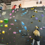 ASC MB Athletes Hanging Out At The Top Out Wall With Another Athlete Climbing Up To Join Them