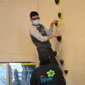 ASC MB Athlete Climbing The Wall At The Hive Getting Direction From Hive Staff