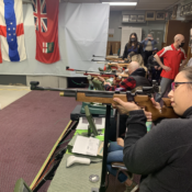 Participants Shooting Rifles